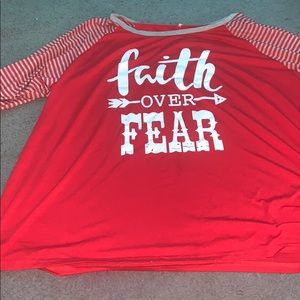 white lettering “faith over fear” shirt